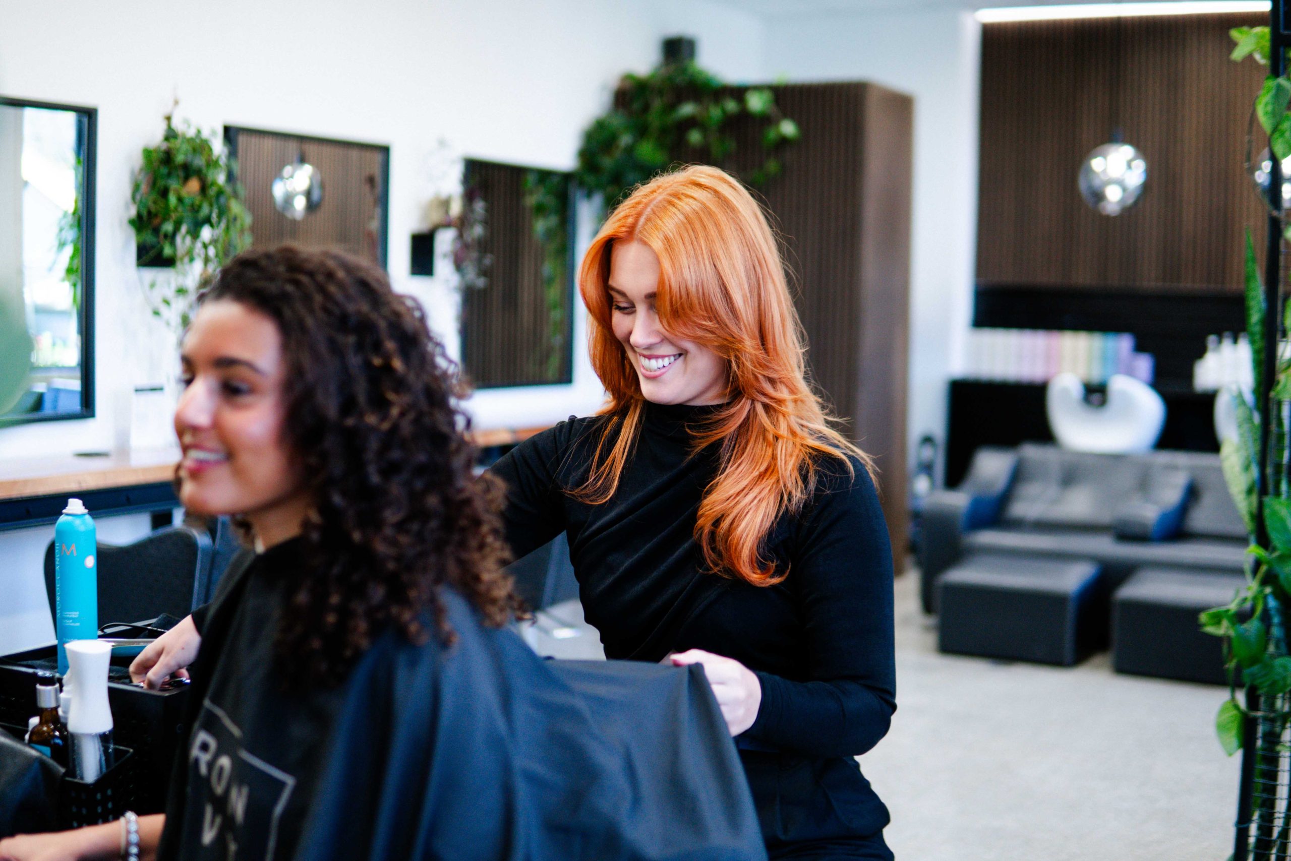 Senior Artist Ronjah working at Iron + Ivy Hair