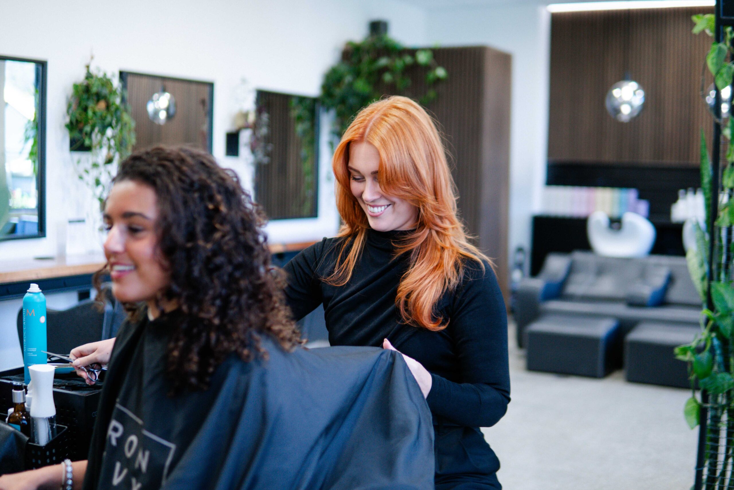 Iron And Ivy Queenstown Copper Stylist Prepping Cape Curly Hair Client 2025.Jpg