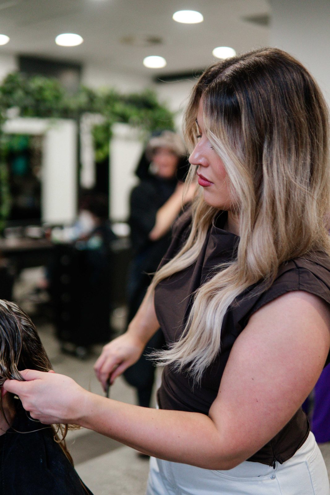 Brushing out long balayage hair at Iron + Ivy Hair Studio, Queenstown