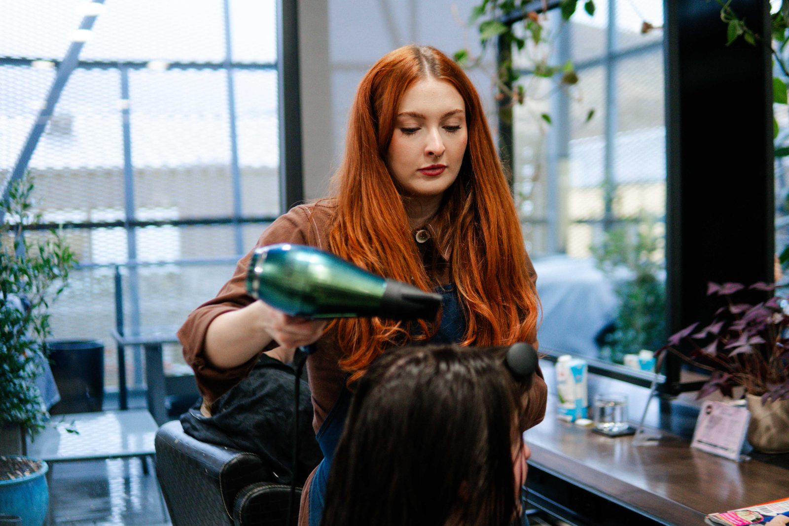 Colour application for a red-haired client at Iron + Ivy Hair Studio, Queenstown