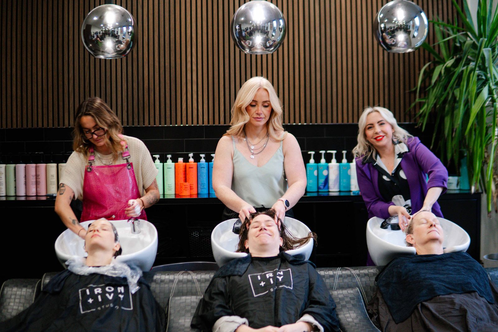Team at the wash stations at Iron + Ivy Hair Studio, Queenstown