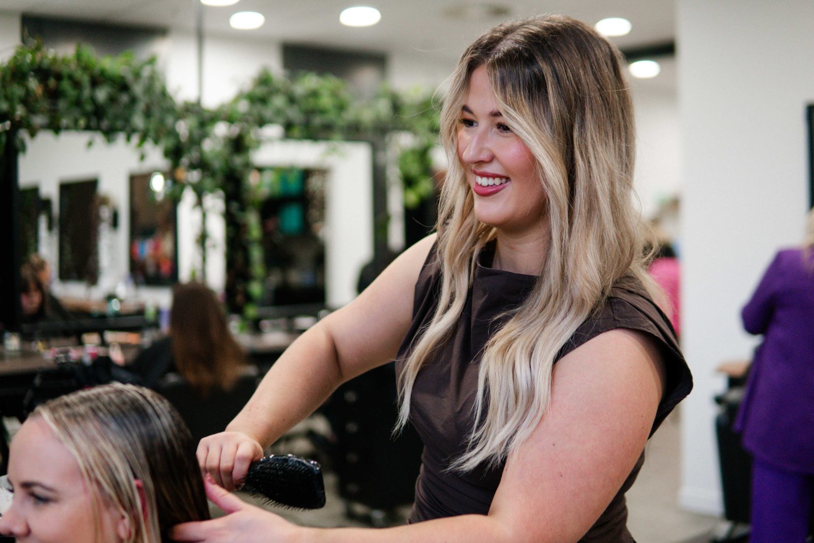 Iron + Ivy stylist with a client in the Queenstown salon